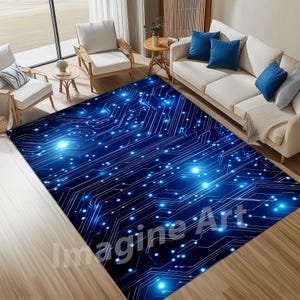 Op de afbeelding: Een blauw en wit abstract vloerkleed met een print van een printplaat en gloeiende blauwe lichten. Het vloerkleed heeft de tekst "Imagine Art" in witte letters.