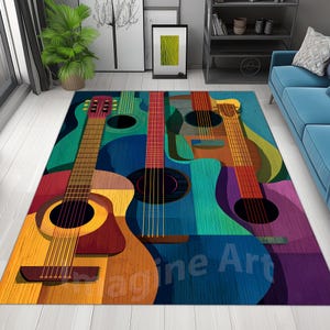 May include: A rectangular area rug featuring a colorful, abstract design of acoustic guitars. The guitars are in shades of yellow, red, blue, green, and purple. The rug has the text "Imagine Art" in blue.