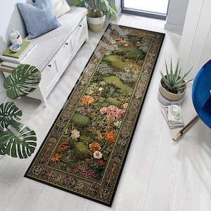 May include: A long, rectangular rug with a floral design. The rug features a dark green border with an ornate pattern. The center of the rug displays a garden scene with various flowers in shades of orange, pink, and white.