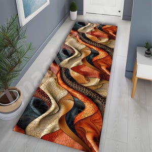 May include: A rectangular hallway rug with a wavy, abstract design. The rug features a mix of colours including beige, black, orange, and brown. The pattern has a textured appearance, with sections resembling cracked leather or a honeycomb.