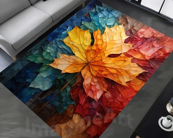 May include: A rectangular area rug featuring a large, stylized maple leaf in shades of yellow, orange, and red. The leaf is set against a mosaic-like background of blues, greens, and reds. The rug is designed for home decor.