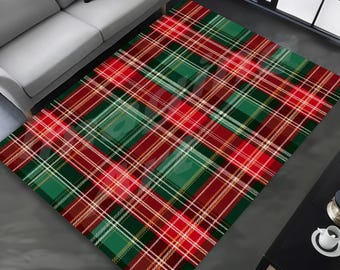 May include: A rectangular area rug with a classic plaid pattern in red, green, and white. The rug features a repeating design of intersecting lines, creating a traditional tartan look. The rug is placed on a gray floor, and a sofa is visible in the background.