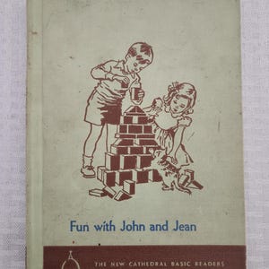 May include: A set of three ceramic mugs with a speckled, matte finish. The mugs are in shades of cream, light gray, and dark gray. Each mug has a simple, minimalist design and a rounded handle. The mugs are suitable for coffee, tea, or other beverages.