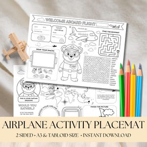 May include: Airplane activity placemat with a bear pilot, mazes, and coloring sections. Includes a wooden airplane model and colored pencils. The text reads "Welcome Aboard Flight" and "Airplane Activity Placemat".