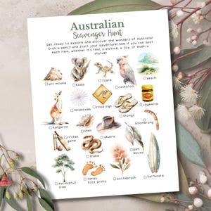 Puede incluir: Una hoja impresa titulada "Búsqueda del tesoro australiana" con ilustraciones de iconos australianos como un koala, un canguro y un tarro de Vegemite. El texto invita a explorar las maravillas australianas.