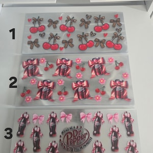 May include: Three sets of decorative stickers. The top set features red cherries and leopard print bows. The middle set showcases Dr. Pepper cans with pink bows and cherries. The bottom set displays Dr. Pepper bottles with pink bows and the text "BRING ME A Dr. Pepper & TELL ME I'M PRETTY."