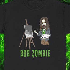 Bob Zombie Unisex T-Shirt aus schwerer Baumwolle - Perfekt für Halloween, Musik Festivals, Geschenke für Horror Fans, Bob Ross + Rob Zombie