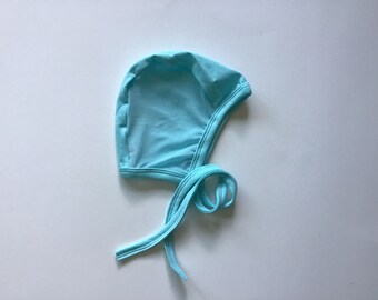 Turquoise pilot hat, hearing aid hat with mesh, cochlear hearing aid hat,Scandinavian style, hat with ties,  snug hat, stretchy hat