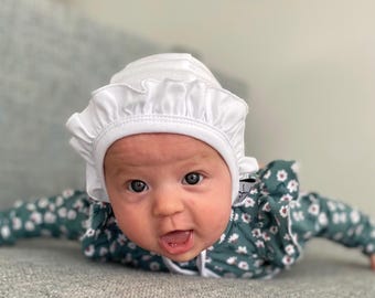 Baby girl ruffle white pilot hat, knit hat, hearing aid cap, baby gift, baby shower gift, hat with ties, toddler knit cap