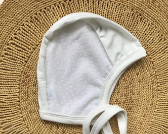 White tiny flower pilot hat, hearing aid hat with mesh, cochlear hearing aid hat,Scandinavian style, hat with ties,  snug hat, stretchy hat