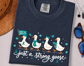 Maglietta Comfort Colors® per la sensibilizzazione sul cancro ovarico, con nastro turchese Just A Strong Goose, supporto per chi è sopravvissuto e combatte.