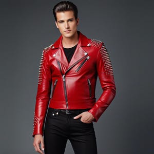 May include: A vibrant red leather jacket, studded with silver embellishments on the shoulders and sleeves. The jacket features a classic biker design with a notched collar and an asymmetrical zip. The model is wearing a black top and black trousers.