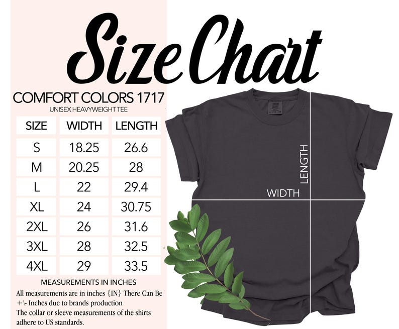 May include: A dark gray Comfort Colors unisex heavyweight tee shirt with a size chart. The chart lists sizes S to 4XL, with width and length measurements in inches. A sprig of green leaves is in the lower left corner.