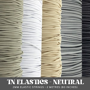 May include: Four spools of 2 mm elastic string in neutral colors: beige, white, gray, and black.  TN Elastics - Neutral. 2MM Elastic Strings - 2 Metres (80 inches).