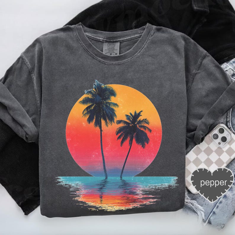 a pair of sneakers and a t - shirt with a palm tree on it