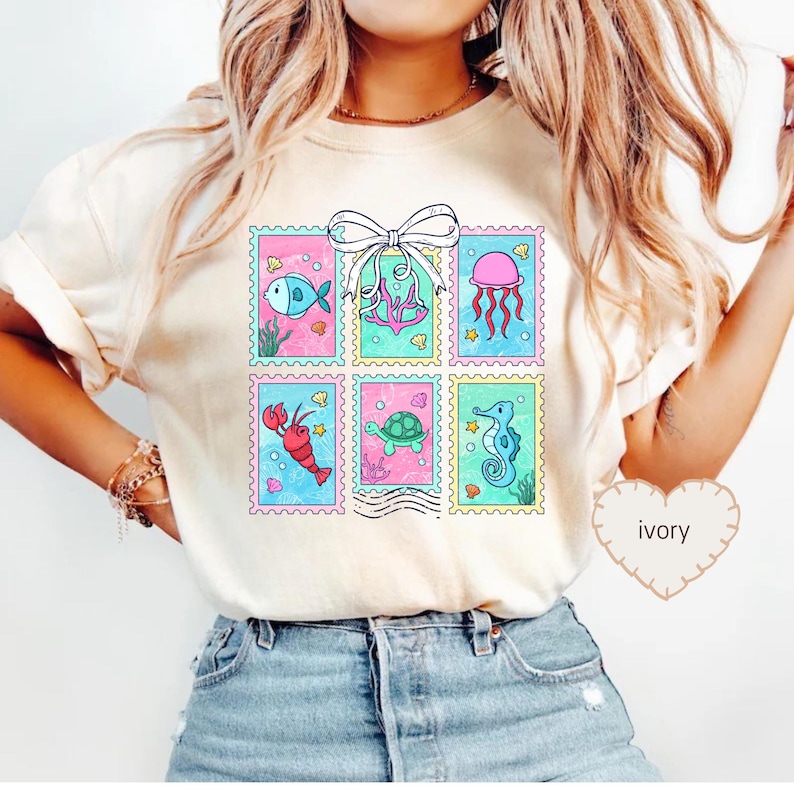 a woman wearing a t - shirt with a picture of a fish on it