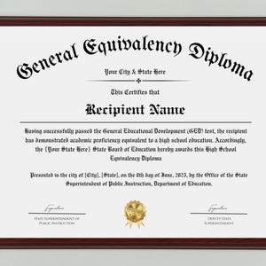 May include: A framed General Equivalency Diploma with a dark wood frame. The diploma features ornate black text on a white background, including the words "General Equivalency Diploma" and "Recipient Name". A gold seal is centered at the bottom.