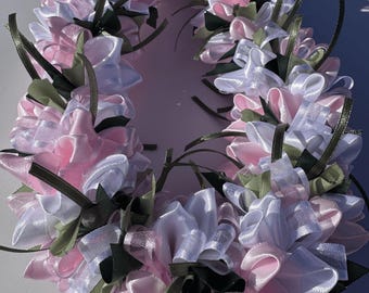 Pink and white plumeria ribbon lei