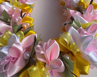 Beautiful pink, yellow, white plumeria ribbon lei