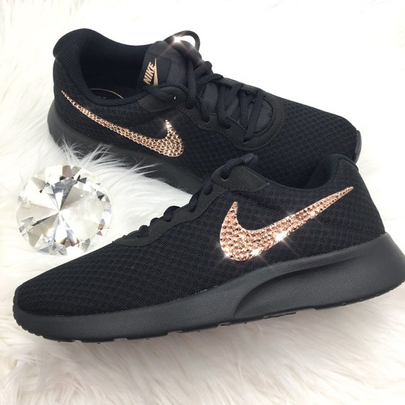 rose gold nike tanjun