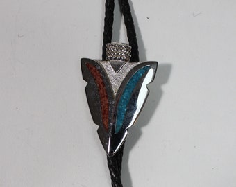 Vintage Western Arrowhead Style With Resin Covered Turquoise Chips Metal Bolo Tie. Black Leather Braid With Metal Tooled Tassels