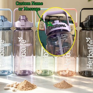 Custom Name 64 oz HERBALIFE Water Bottle | Portable Handle Extra Space Cup with Straw, Leakproof, Time Markers | Gym Hiking Camping Gift