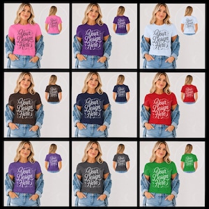 May include: A collection of nine short-sleeve crew neck t-shirts in various colors, each featuring the text Your Design Here in a decorative script font. Each shirt is layered under a blue denim jacket, showcasing both front and back views.