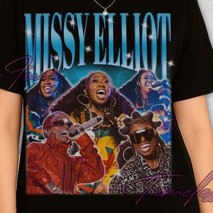 May include: Black t-shirt featuring a vintage-style graphic of Missy Elliott and the text "MISSY ELLIOT" in blue. The graphic includes images of Missy Elliott performing. The shirt is a classic crew neck.