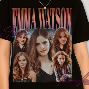 May include: Black t-shirt featuring a collage of Emma Watson images with the text "EMMA WATSON" in a gradient font. The shirt has a crew neck and short sleeves. The design is centered on the front of the shirt.