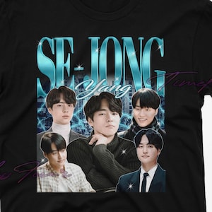 May include: Black t-shirt featuring a graphic design with the text "SE JONG" in teal and images of five people. The design has a vintage, distressed aesthetic.