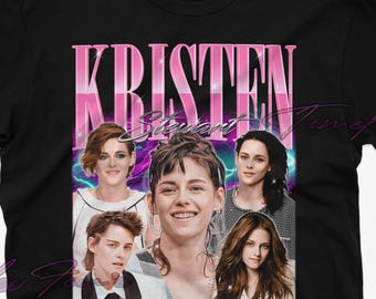 May include: Black t-shirt featuring a pink and purple graphic of Kristen Stewart from the Twilight films. The graphic includes the text "Kristen Stewart" in a pink and purple font.