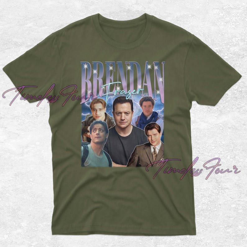 May include: Olive green t-shirt featuring a collage of images of Brendan Fraser with the name "Brendan Fraser" in a stylized font. The design includes multiple images of the actor in various roles, with a vintage aesthetic.