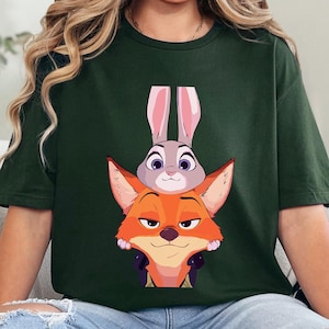 May include: Forest green t-shirt with a cartoon image of Judy Hopps and Nick Wilde from Zootropolis. The text "FOREST GREEN" is printed at the bottom of the image.