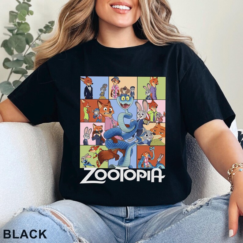 May include: A black t-shirt featuring a grid of various cartoon characters from the movie Zootopia, including a large blue snake in the centre. The word Zootopia is printed in white capital letters at the bottom of the graphic design on the shirt.