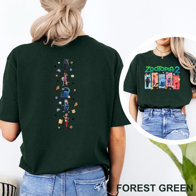 May include: Forest green t-shirt featuring a vertical design of cartoon characters and the text "ZOOTOPIA 2". The shirt is a dark green color and has a crew neck. The design includes various characters and colorful accents.
