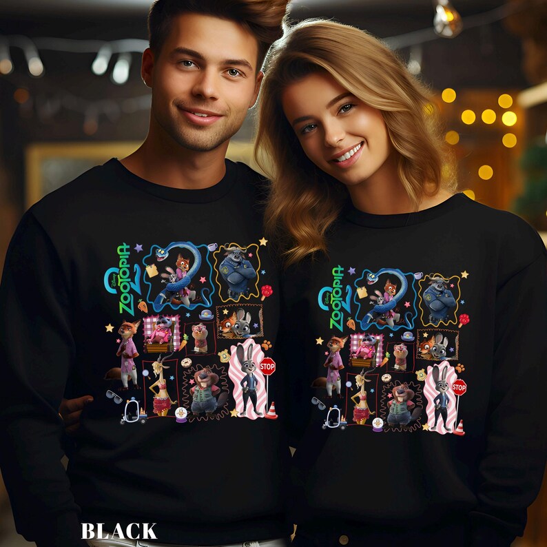 May include: Black sweatshirts featuring a colorful graphic design with characters and the text "Zootopia". The design includes various cartoon characters in frames, with the word "Zootopia" in green and blue. The word "BLACK" is at the bottom.