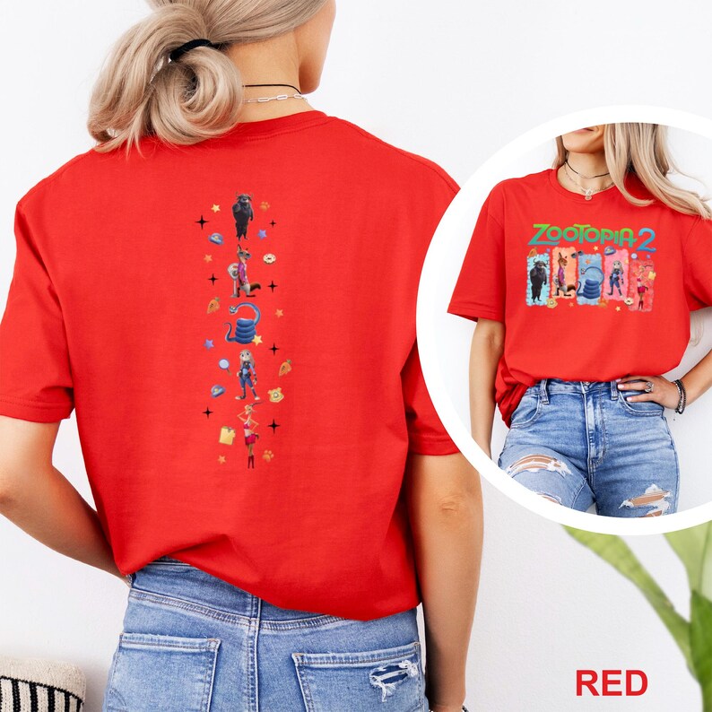 May include: A red t-shirt featuring the text "Zootopia 2" with character illustrations. The back of the shirt has a vertical design with more character illustrations and stars. The shirt is made of a soft material.