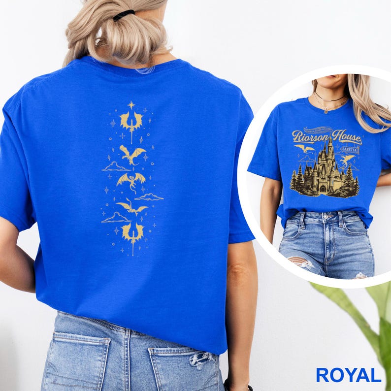 May include: Royal blue t-shirt with a gold dragon design on the back. The design features several dragons, clouds, and stars. A second image shows a blue t-shirt with the text "Riorrson House" and a castle graphic.