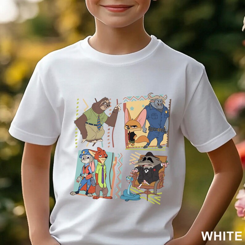 May include: White t-shirt with a colourful graphic of characters from the animated film Zootropolis. The design includes Judy Hopps, Nick Wilde, Flash, and other characters in a square pattern. The word "WHITE" is printed at the bottom.