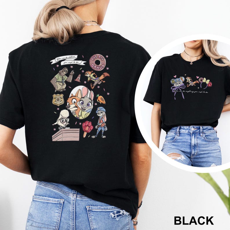 May include: A black t-shirt featuring Zootopia character graphics on the back and front. The back displays a collage of characters, a donut, a badge, and the text "You can be whatever you wish to be." The front shows smaller character icons.