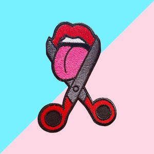 May include: Embroidered patch showing a pair of scissors cutting a red lip with a pink tongue. The scissors are grey with red handles and black details. The patch is set against a blue and pink background.