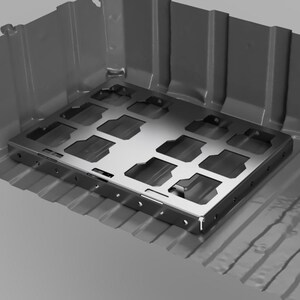 May include: A grayscale image of a metal tray with a grid pattern, set inside a larger, rectangular container. The container has vertical walls and a ribbed base. The overall design suggests an industrial or mechanical component.