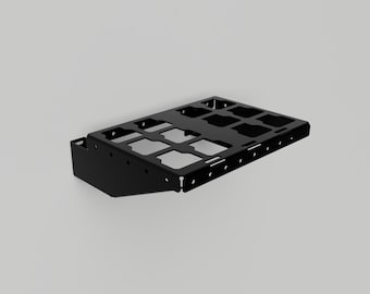 May include: A black metal storage rack with multiple rectangular cutouts. The rack has a slightly angled design and a side panel on the left. The object is set against a plain, light gray background.