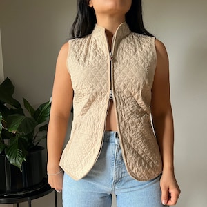 vintage quilted beige vest, everyday minimal outdoor wear, zip front pockets, retro 00s minimalist basics