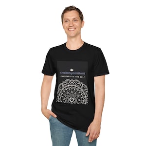 May include: Black t-shirt featuring a white and gray mandala design with the text "chaitanyamātmā AWARENESS IS THE SELF". The shirt is made of a soft material and has a crew neck.