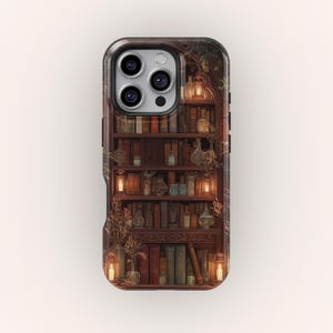 May include: A phone case featuring a detailed illustration of a wooden bookshelf filled with books, glass bottles, and lit lanterns. The design has a warm, inviting color palette with a vintage aesthetic.