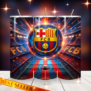 May include: A stainless steel tumbler with the FC Barcelona logo, a football, and a stadium scene. The design uses the team's colours of blue, red, and gold, with the text "FCB" visible. The tumbler has a straw and a "Best Seller" banner.