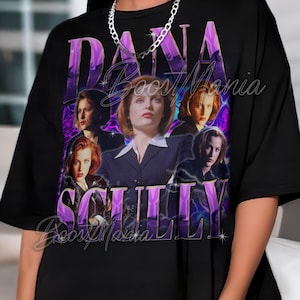 May include: Black t-shirt featuring a graphic of Dana Scully from The X-Files. The design includes multiple images of the character, the name "DANA SCULLY" in purple, and the text "BoosMania".