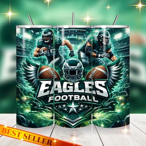 May include: A stainless steel tumbler featuring a vibrant design of the Philadelphia Eagles football team. The design includes players in action, footballs, a helmet, and the words "EAGLES FOOTBALL". The tumbler has a "BEST SELLER" banner.