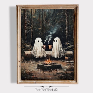 May include: Framed art print depicting two ghost figures sitting by a campfire in a forest. The ghosts are holding mugs, and steam rises from the fire. The artwork has a vintage, painterly style with a warm color palette.
